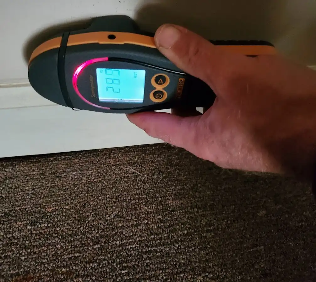 Moisture detection at baseboard during Storm Damage Restoration in Broadview Heights